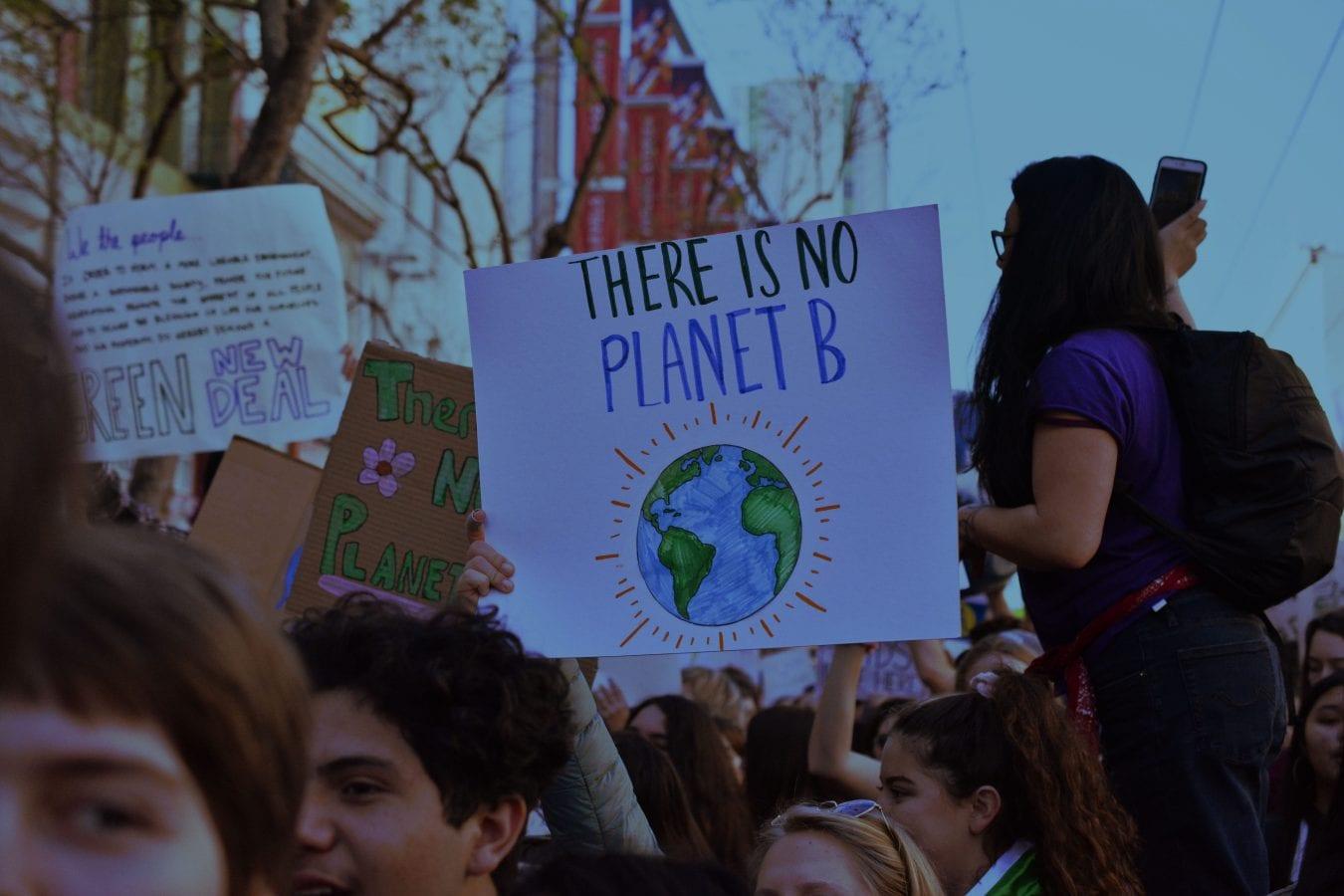 Young people demonstrating for new policies to avoid climate change